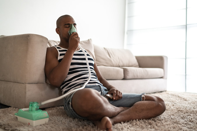 Man Holding A Mask Steam Inhaler