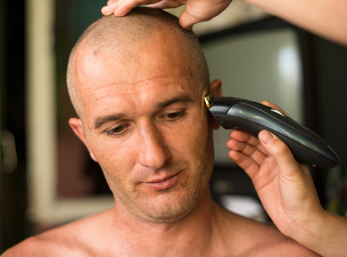 Shaving a mans head
