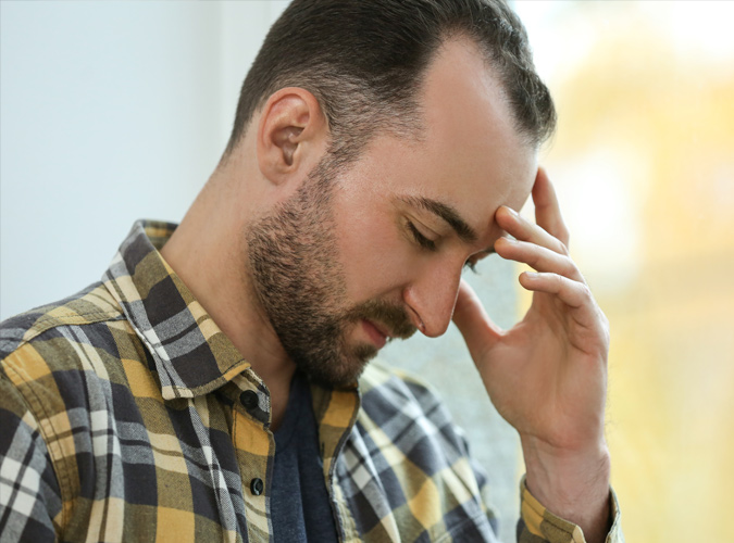 Stressed man with receding hair line