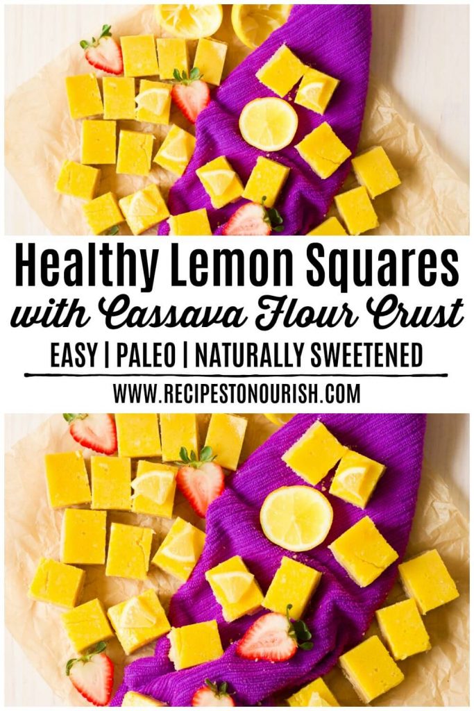 Homemade lemon squares with fresh lemon and strawberries.