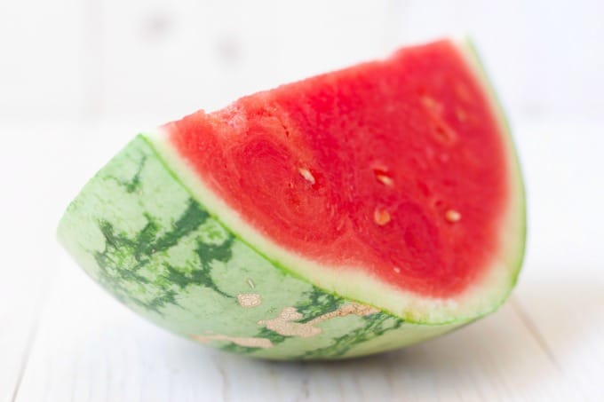 Quarter slice of fresh watermelon.