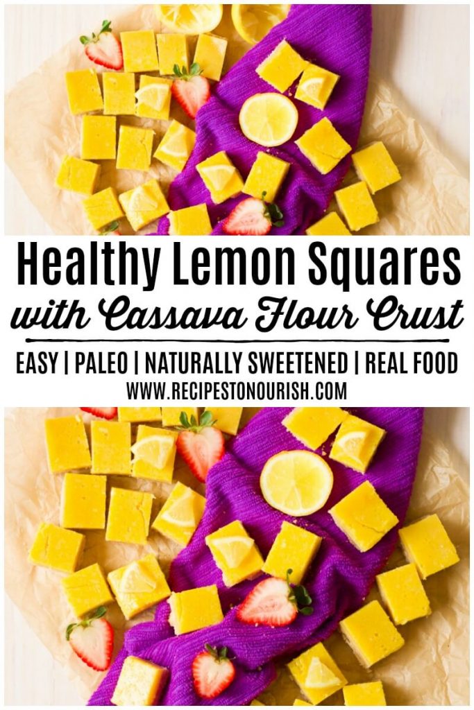 Homemade lemon squares with fresh lemon and strawberries.